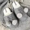 Капці домашні жіночі з помпонами сірі