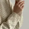 Светр вʼязаний молочний у блакитну квітку "onesize"